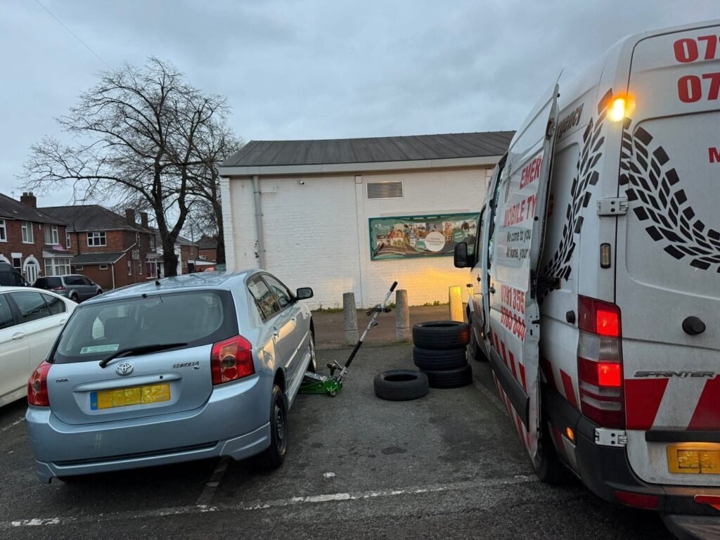 Commercial mobile tyre fitting equipment beside a vehicle